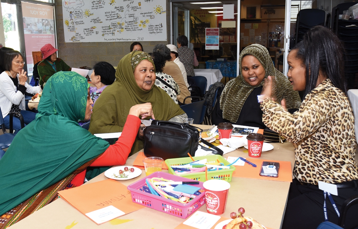 women discussing ideas to improve the community at our annual Bright Ideas seminar