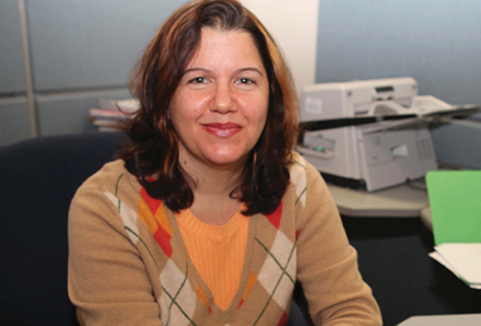 Newcomer woman working in an office