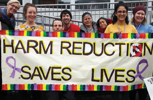 people holding banner that reads 