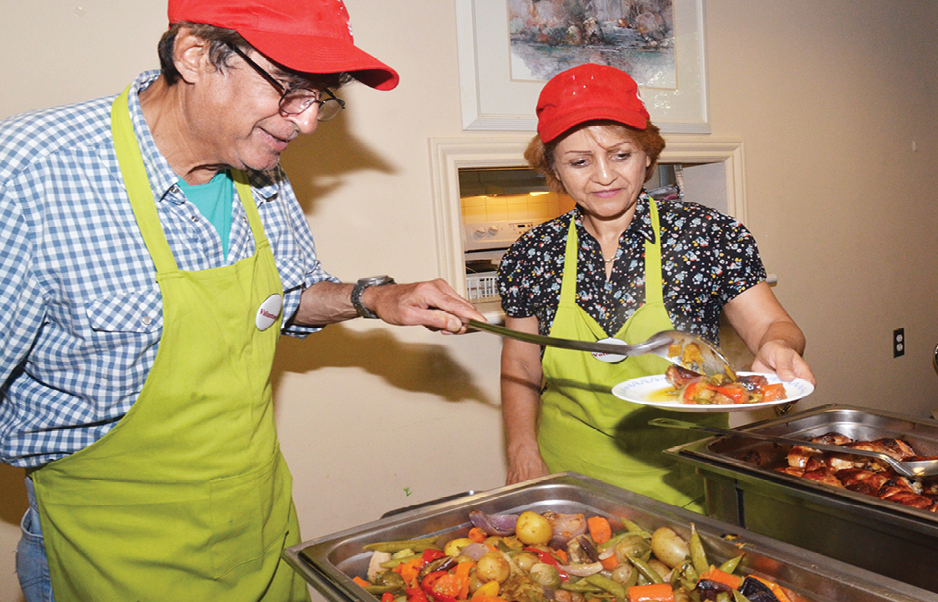 volunteers serving dinner