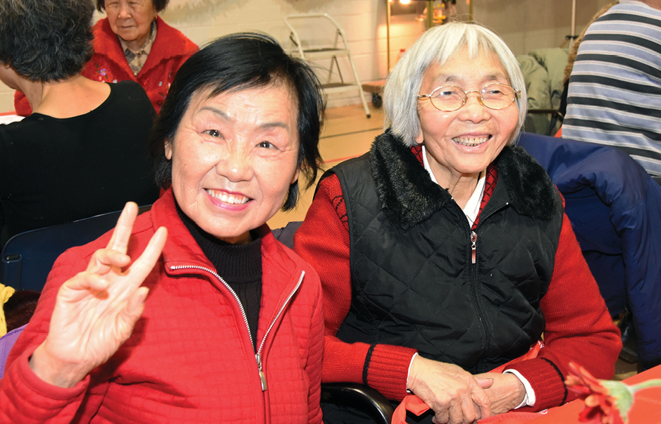 two elderly women smiling