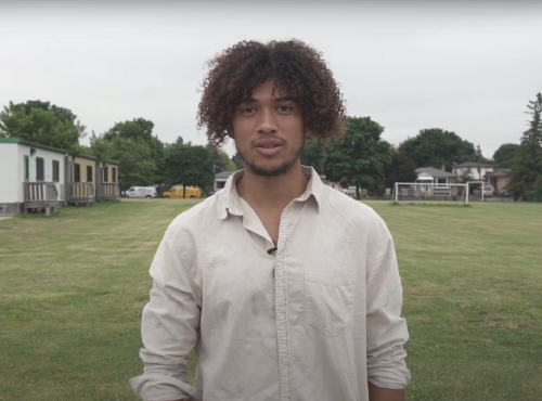 young man standing in park