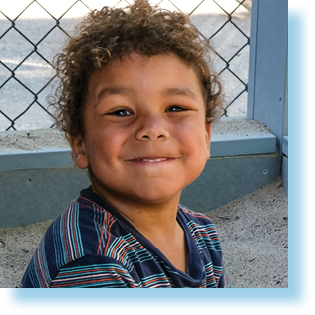 boy playing in sandbox