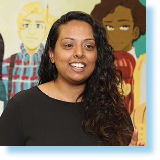 smiling woman in front of multicultural mural