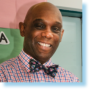 smiling teacher in classroom