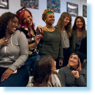 a group of young women smiling