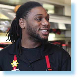 smiling young man in coffee shop