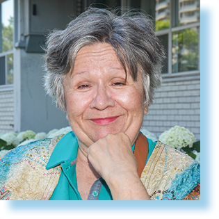 smiling woman sitting outside