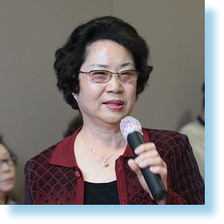 Woman speaking into microphone