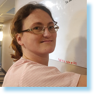 woman looking at a whiteboard