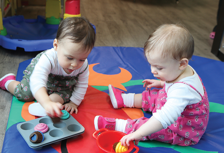 Twin toddlers playing together