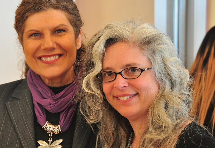 Two women smiling at camera