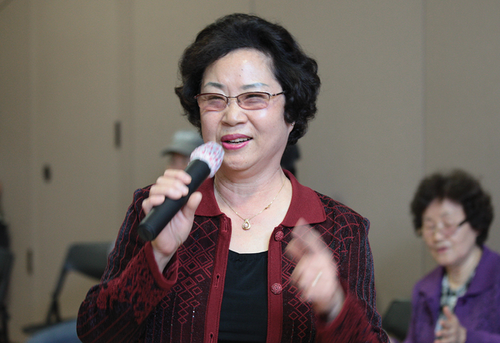 Woman speaking into microphone