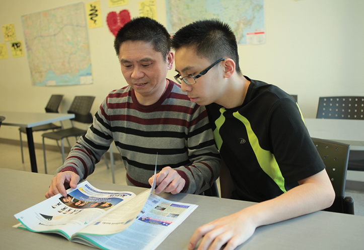 Father and son reading