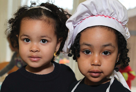 young girls playing dress-up at the King Edward Child Care Centre