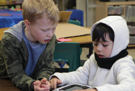 two boys playing inside the Lord Lansdowne Child Care Centre