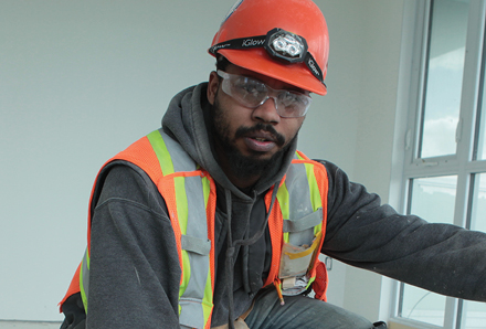 young man working doing construction