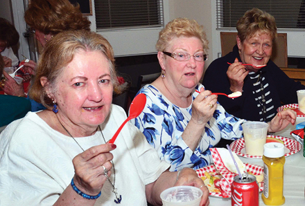 elderly women sharing a meal in the dining room at 11 Coatsworth