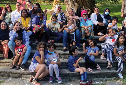 women and children at barbeque in the park