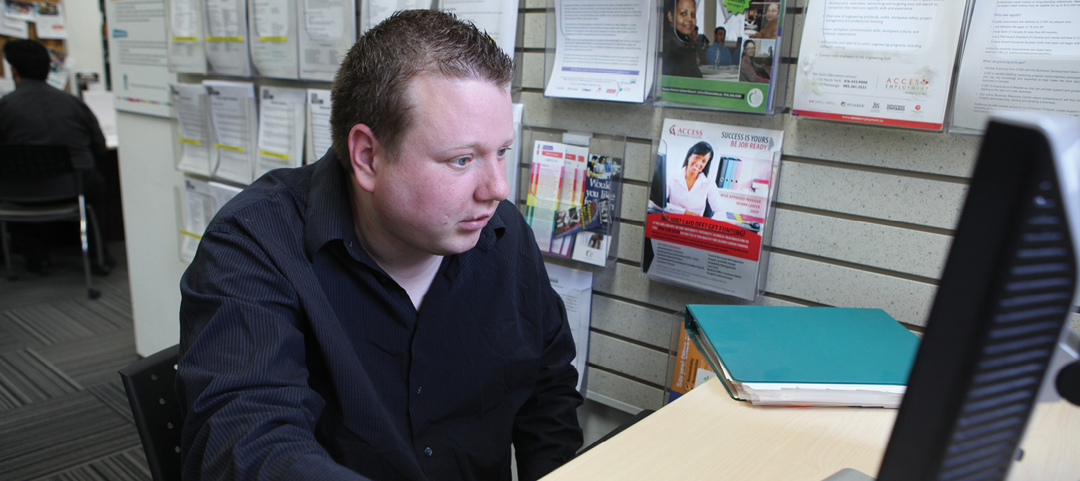 man working at computer in Employment resource centre