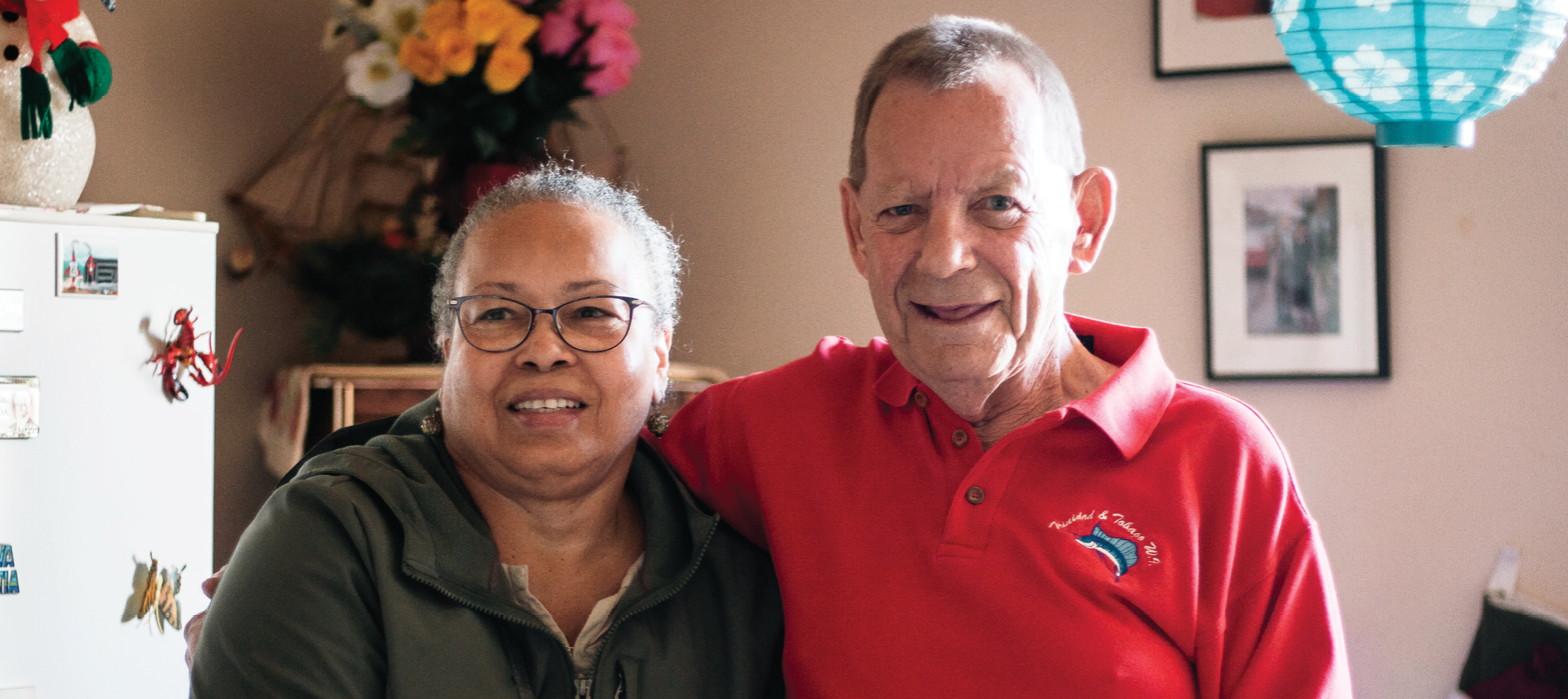 volunteer standing with a senior