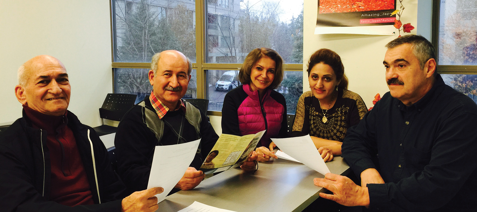 newcomers around a table at our North York Newcomer Centre