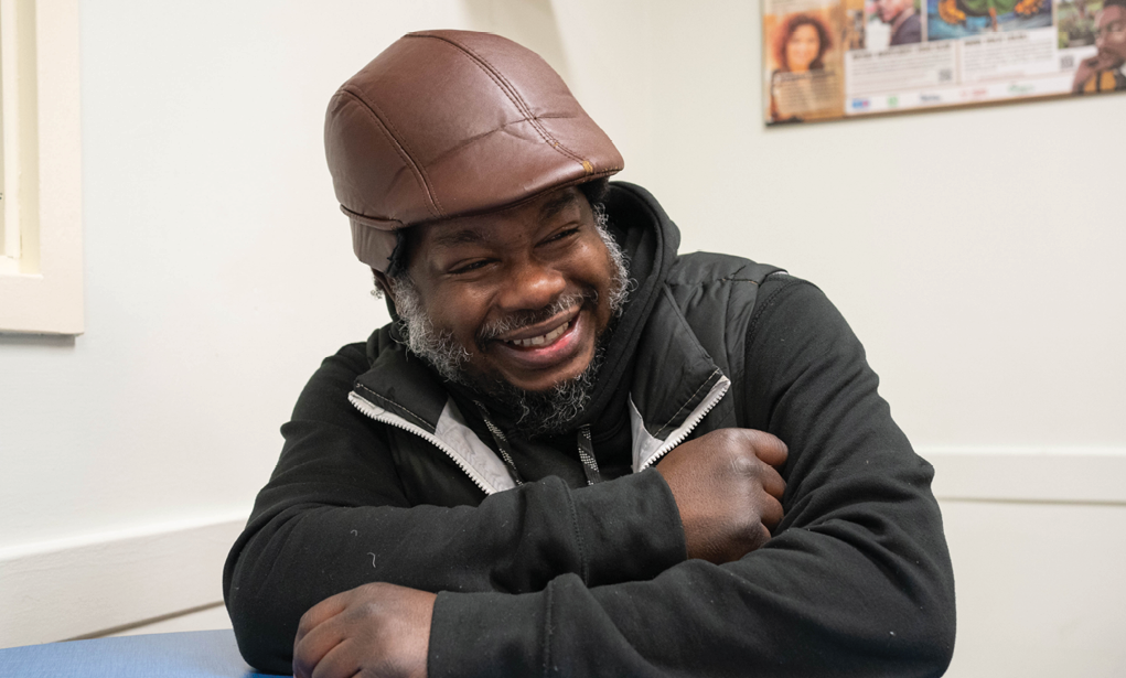 smiling man sitting in the Corner Drop-in