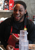 young man working in a coffee shop